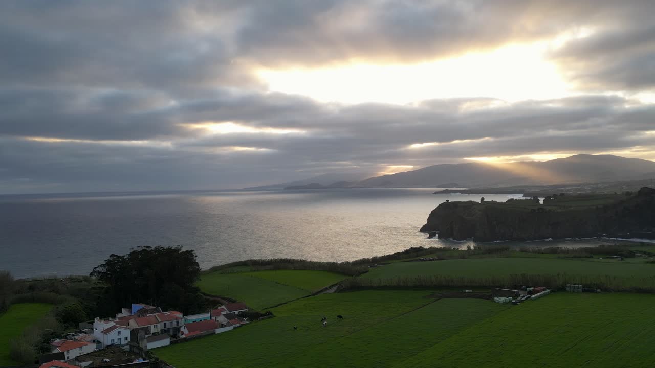Epic sunset captured by drone over San Miguel Island. Aerial view showcasing the stunning landscape and sunset over the Atlantic Ocean. Azores, Atlantic coastline, 4K footage.