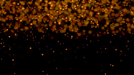 animación de múltiples manchas doradas brillantes de luz que se mueven en movimiento hipnótico sobre un fondo negro