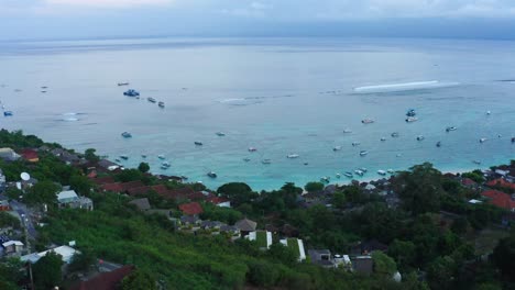 Top-down-aerial-view-of-fishing-harbour,-fisherman-village-and-boats