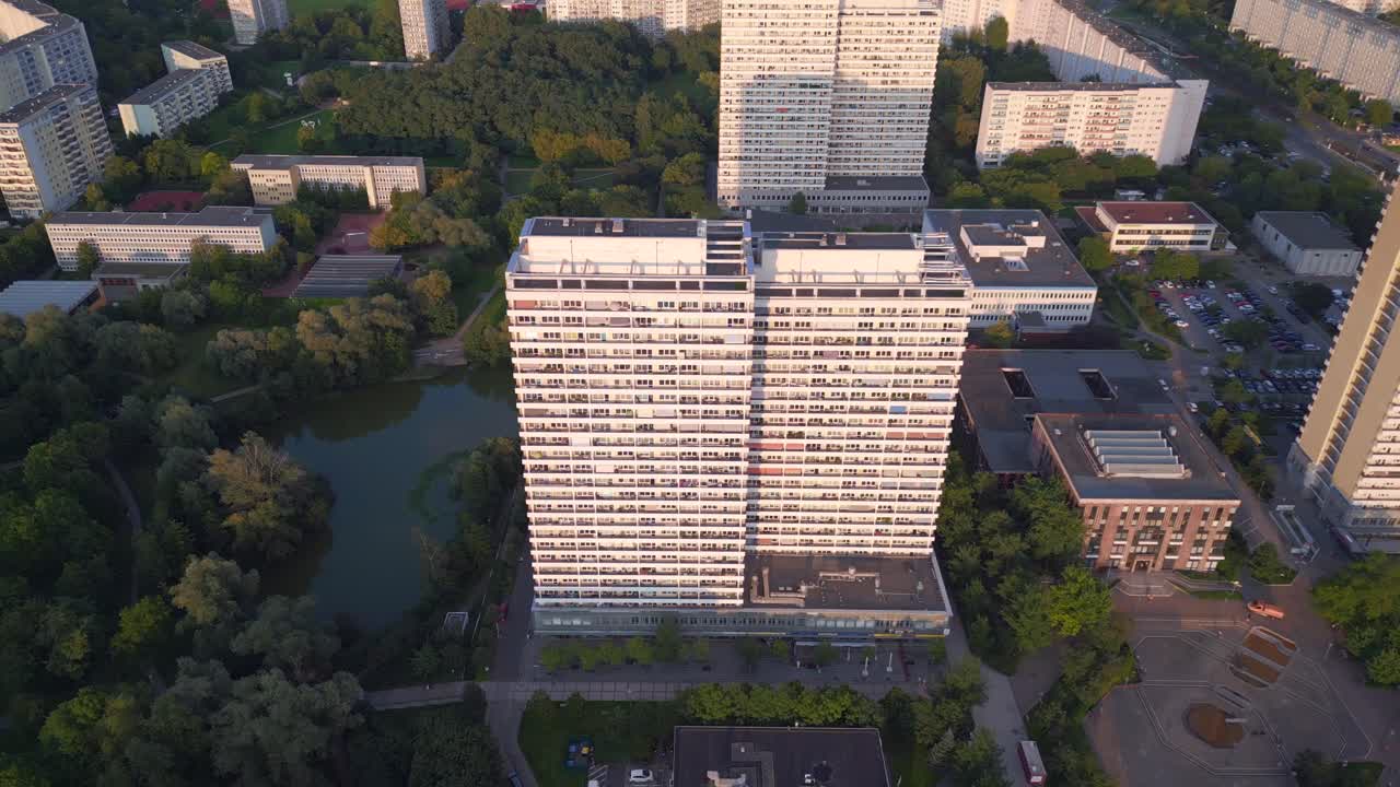 Beautiful aerial top view flight Panel system building, prefabricated housing complex, Berlin Marzahn East Germany golden hour 2023