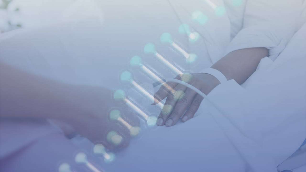 Animation of dna strand over biracial female patient in hospital bed and caucasian doctor treating
