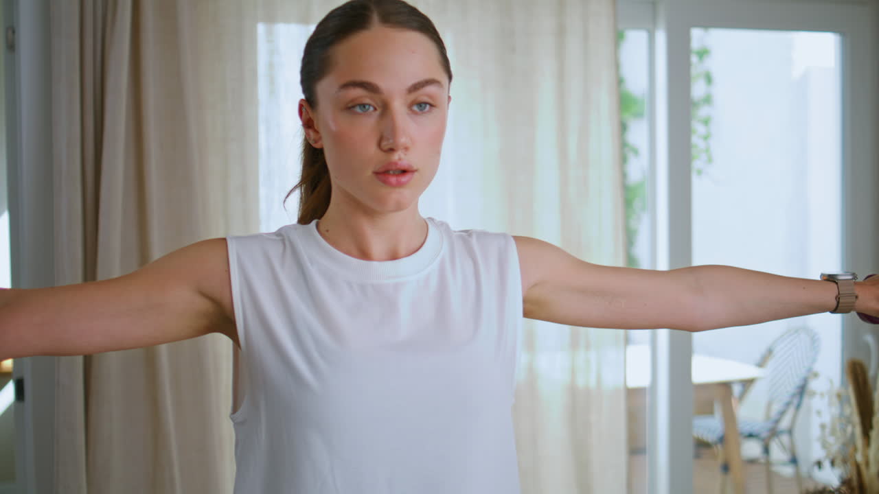 Energetic lady training arms at home enjoying morning wellness routine closeup