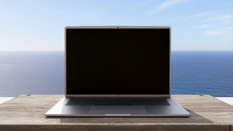 laptop on a wooden table with ocean view