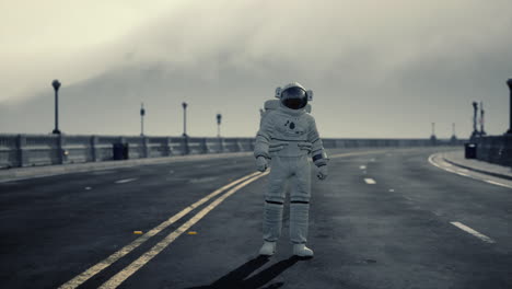 astronaut walks in the middle of a road