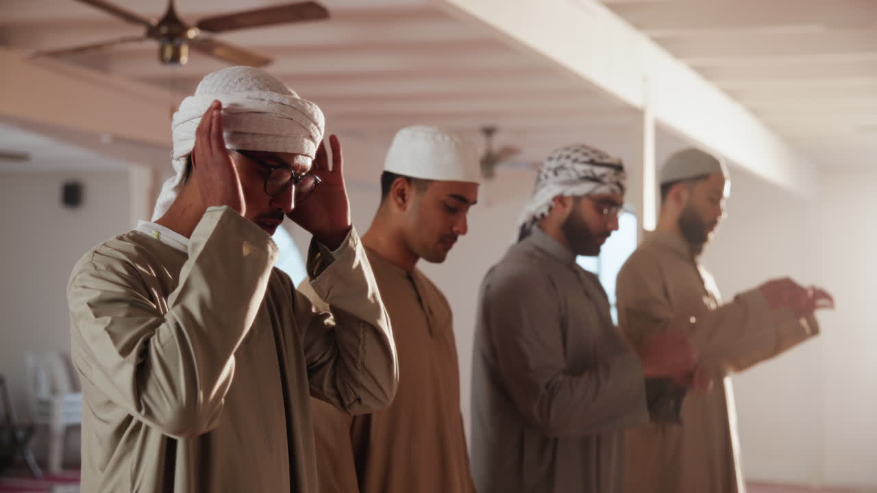 Muslim men praying in mosque