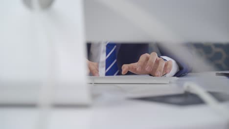 Close-up-hands-of-businessman-working.