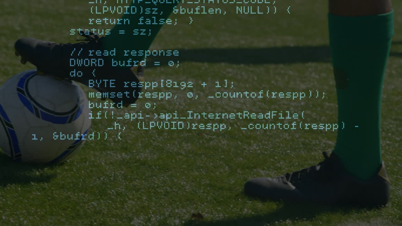 Data processing against low section of male soccer player with soccer ball on sports field