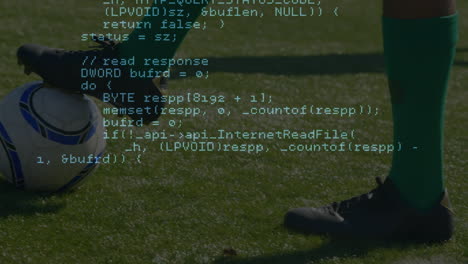 data processing against low section of male soccer player with soccer ball on sports field