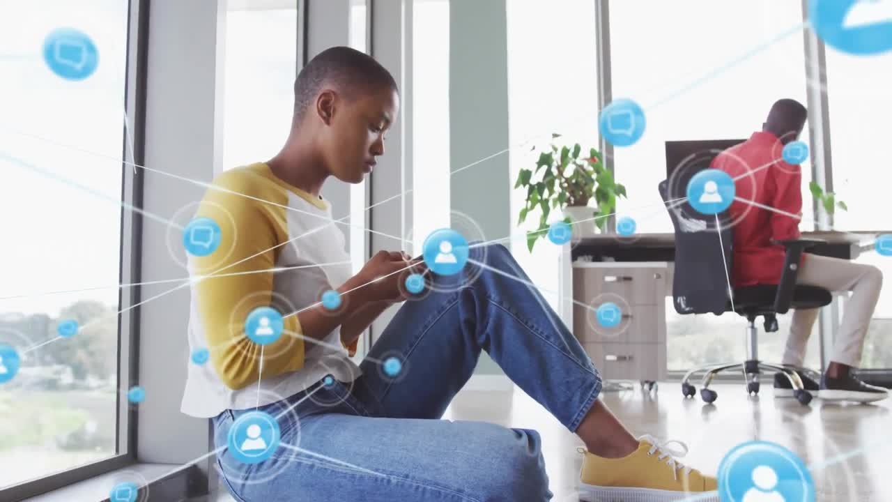 Animation of icons and connections over african american businesswoman in office