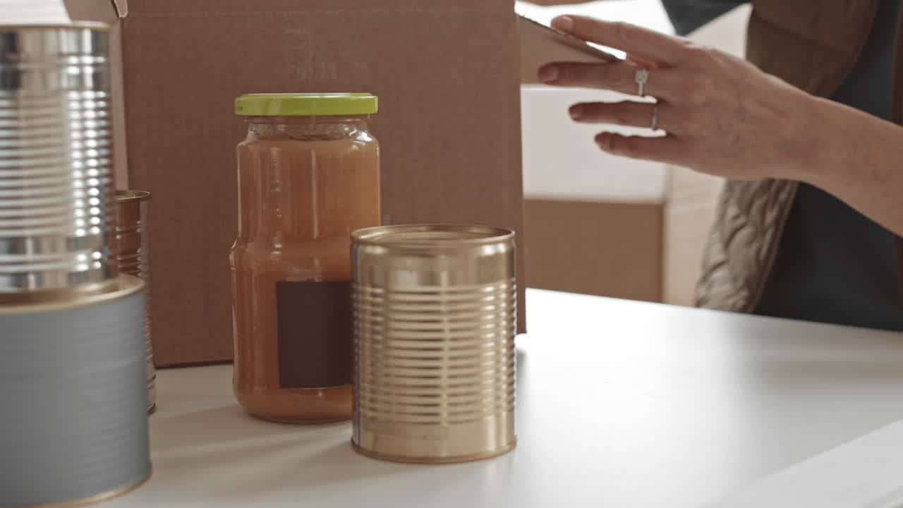 Food drive donation with canned goods and jar