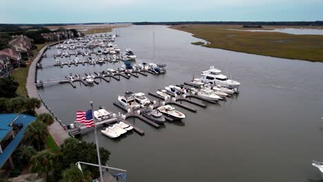 american flag flying in the breeze at marina on bohicket creek near kiawah island and seabrook island sc, south carolina