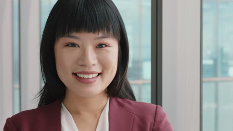 portrait successful asian business woman smiling looking confident independent female in office executive enjoying career in corporate leadership company manager at work