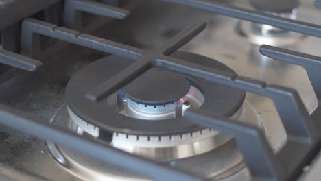 Close-up-of-a-gas-stove-burner-being-turned-on-and-off