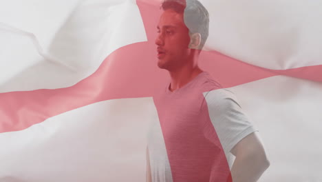 animation of flag of england over caucasian male athlete