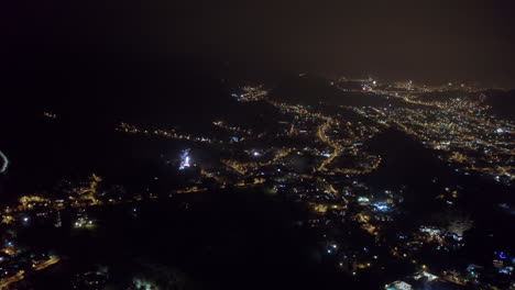 Aerial-dolly-shot-of-the-firework-celebrations-on-New-Years-Eve-above-Lima-city-in-Peru