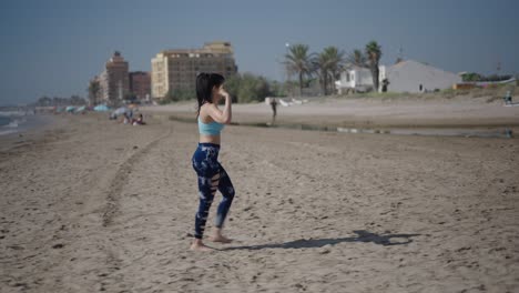 woman exercising on a sunny beach