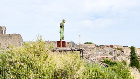 statue overlooking the ruins of pompeii, embodying the art and cultural heritage of the ancient roman city