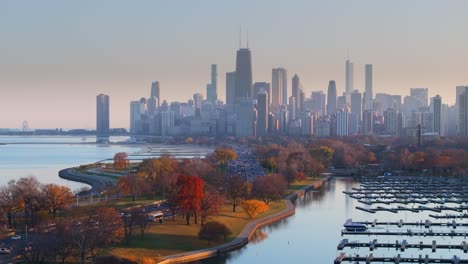 Aerial-view-of-Chicago-lake-shore-drive-with-fall-colors-and-city-skyline-in-background