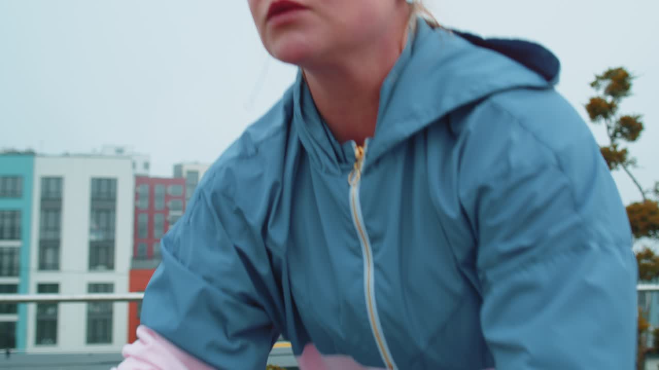 Woman performs aerobic endurance training workout cardio routine on the simulators cycle training