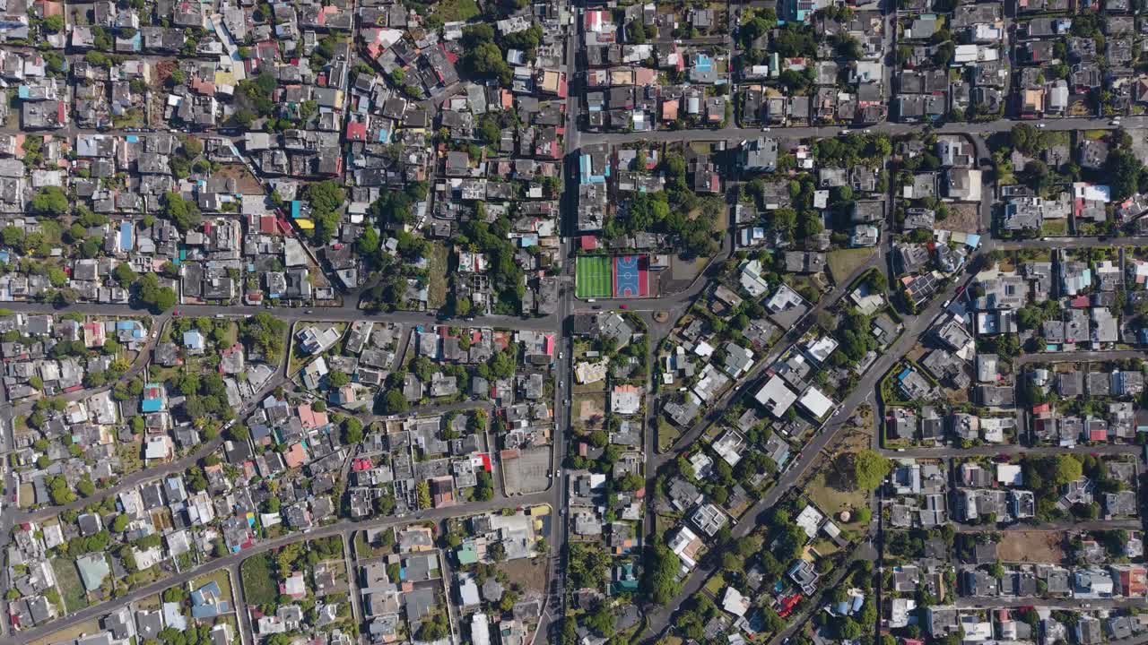 Top-down aerial view of Beau Bassin Rose Hill, Mauritius, showing dense urban housing, streets, and greenery in a tropical city environment