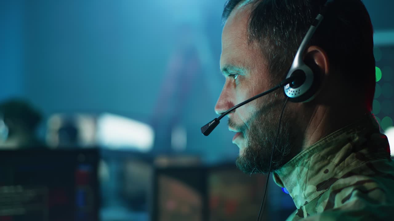 Military man giving commands in control center