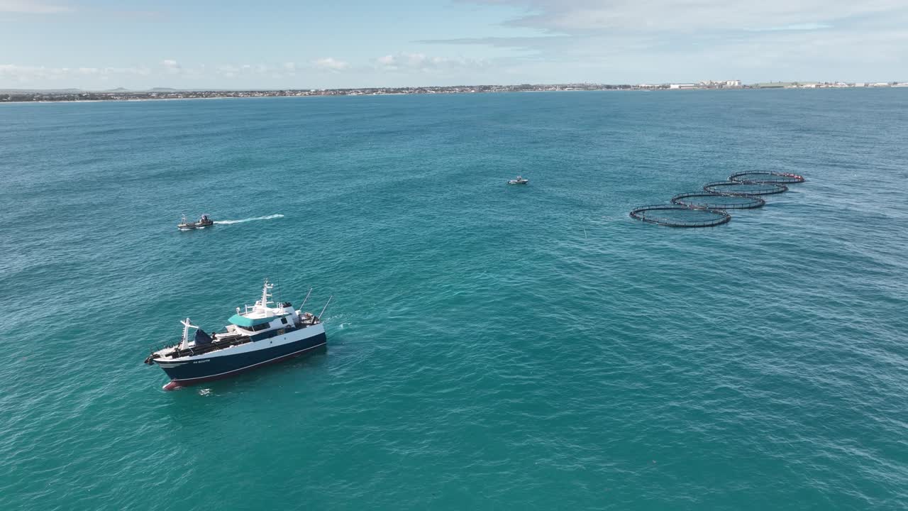 Aerial View of a Fish Farm in the Ocean with Boats