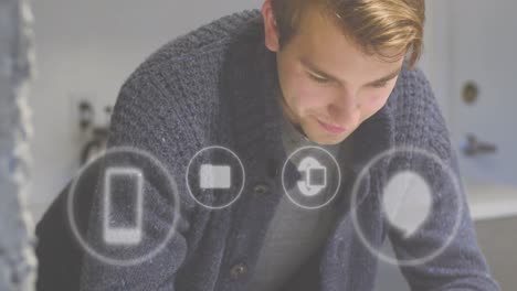 Animation of icons and data processing over caucasian businessman in office
