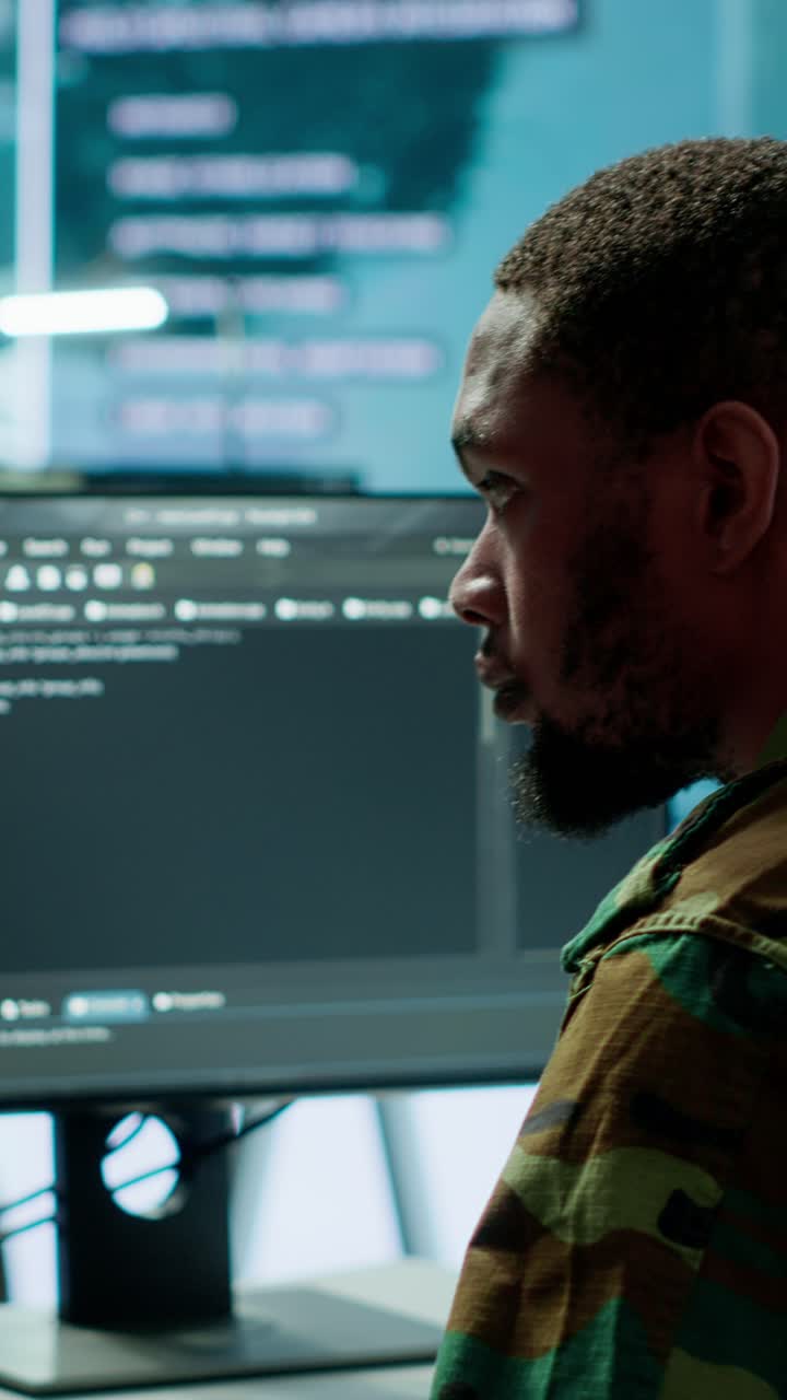 Vertical Video Soldier working with AI intelligence on pc in control room
