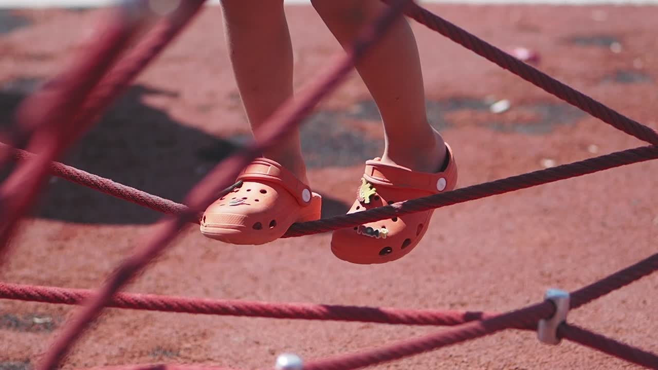 Child on a rope climbing frame