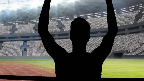 animación de la silueta de un atleta masculino animando con los brazos en el aire sobre el estadio deportivo