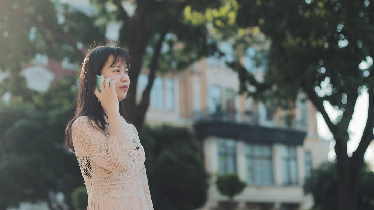 Woman using phone on the street