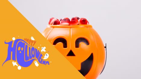 Animation-of-happy-halloween-text-over-sweets