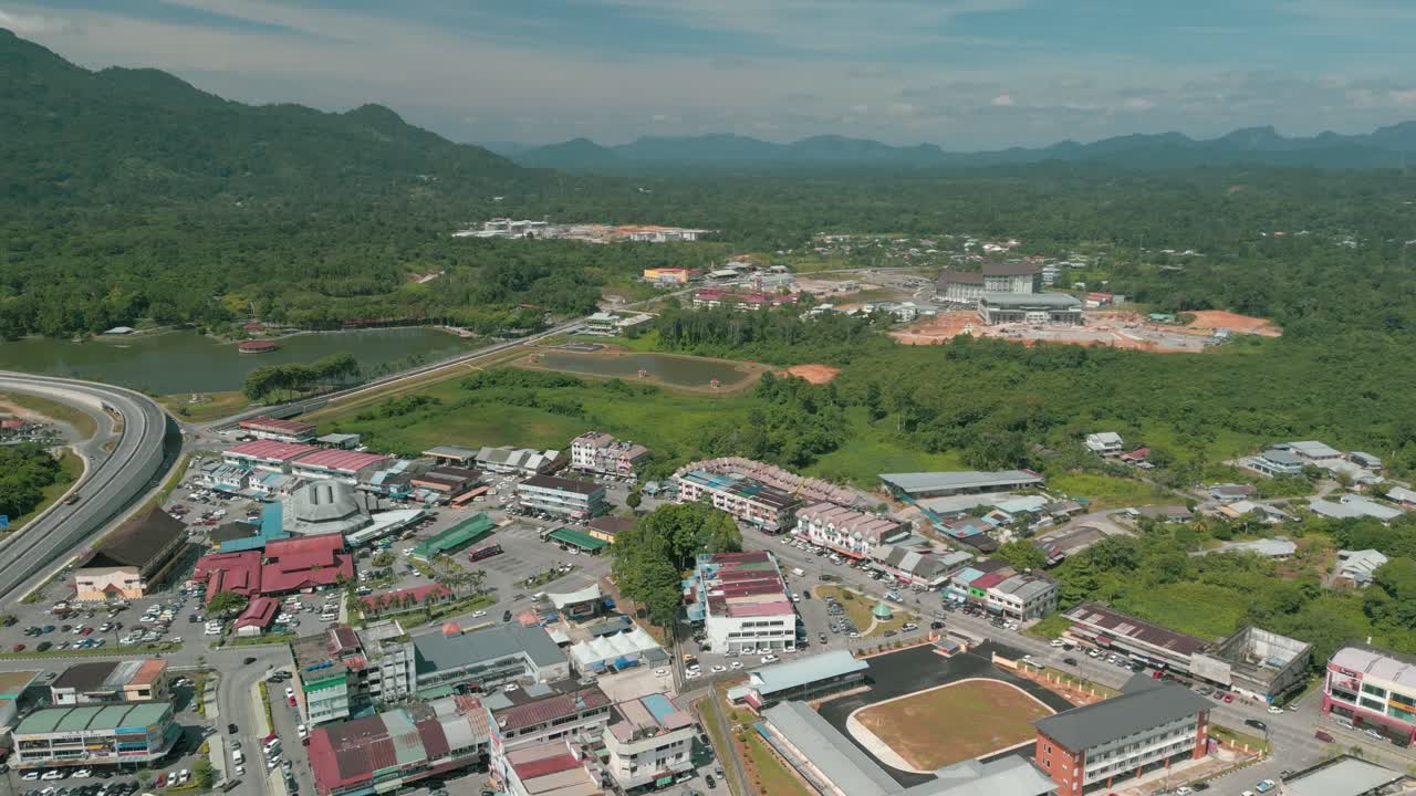 Aerial Drone View, Serian District Town ,Summer With Beautiful Green Trees,New Building And Water Park Lake, Water From The Mountain Sarawak,Borneo.