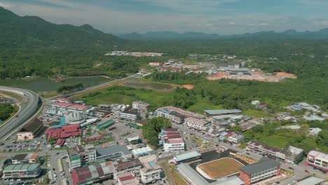 aerial drone view, serian district town ,summer with beautiful green trees,new building and water park lake, water from the mountain sarawak,borneo.