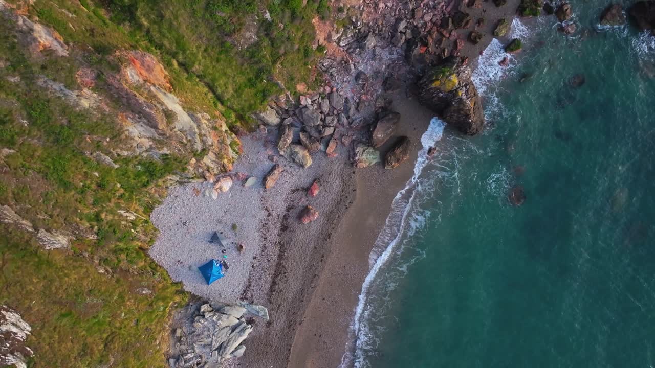 4K Cinematic Drone Footage of tents at aTiny Hidden Beach in Howth - Co.Dublin - Ireland_21