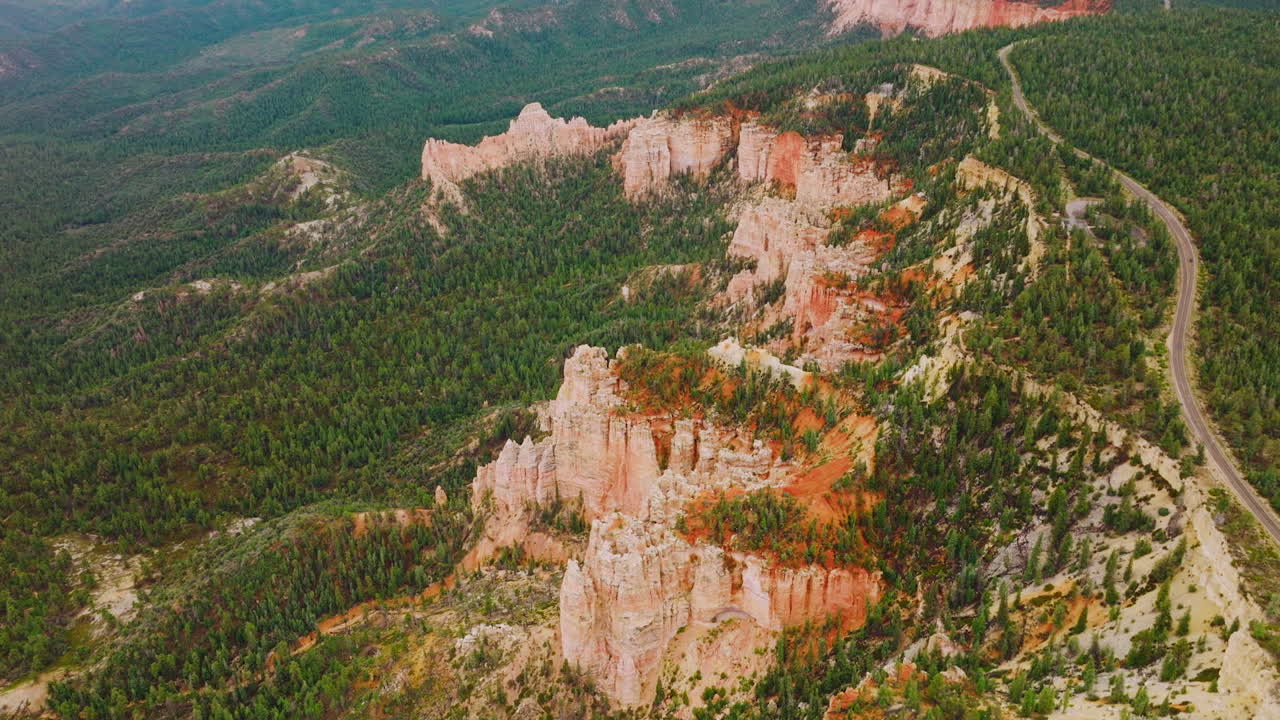 Pine forests covering the land around amazing canyons. Scenic panorama of American National park in Utah. Top view.