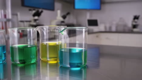 colorful liquids in beakers in a laboratory