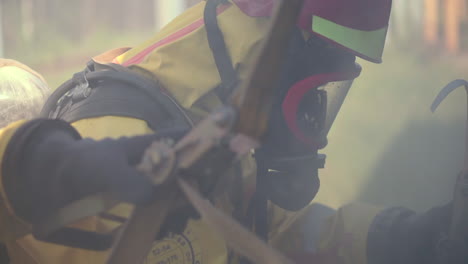 firefighters in protective gear at a fire scene