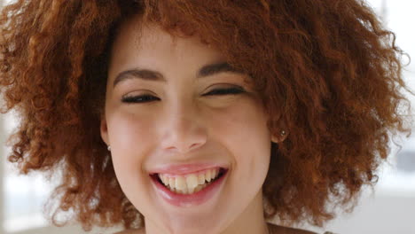 confident beautiful woman with an afro laughing