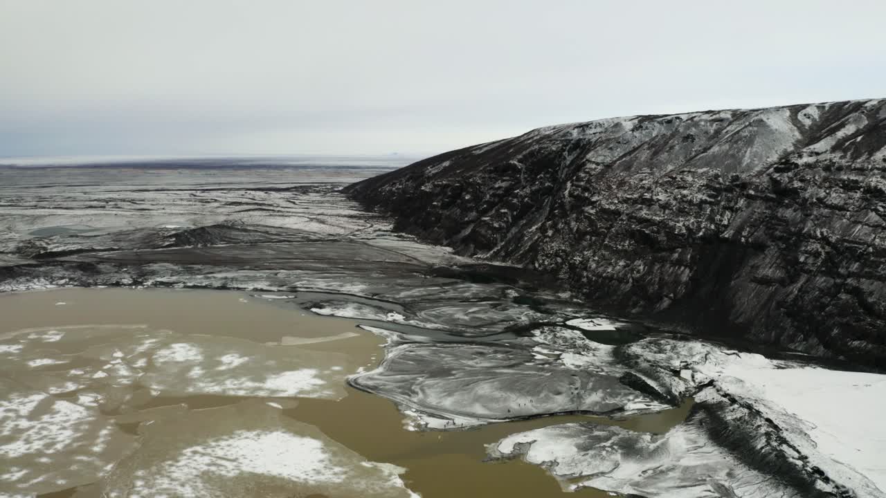 Stunning footage capturing the dramatic cliffs, muddy waters, and expansive plains near Svinafellsjokull glacier.