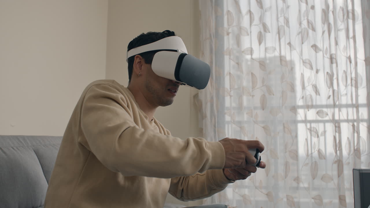 Virtual reality gameplay experience at home with user wearing VR headset and controller in hands