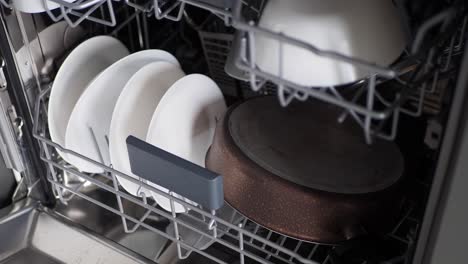 dishwasher with dishes and pots