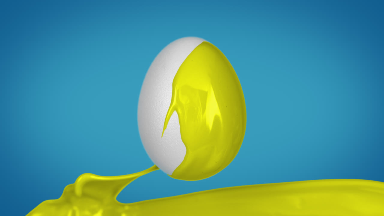 파스터 달은 염료를 뿌려 노란색으로 칠해져 있습니다. 느린 동작, 파란색 배경