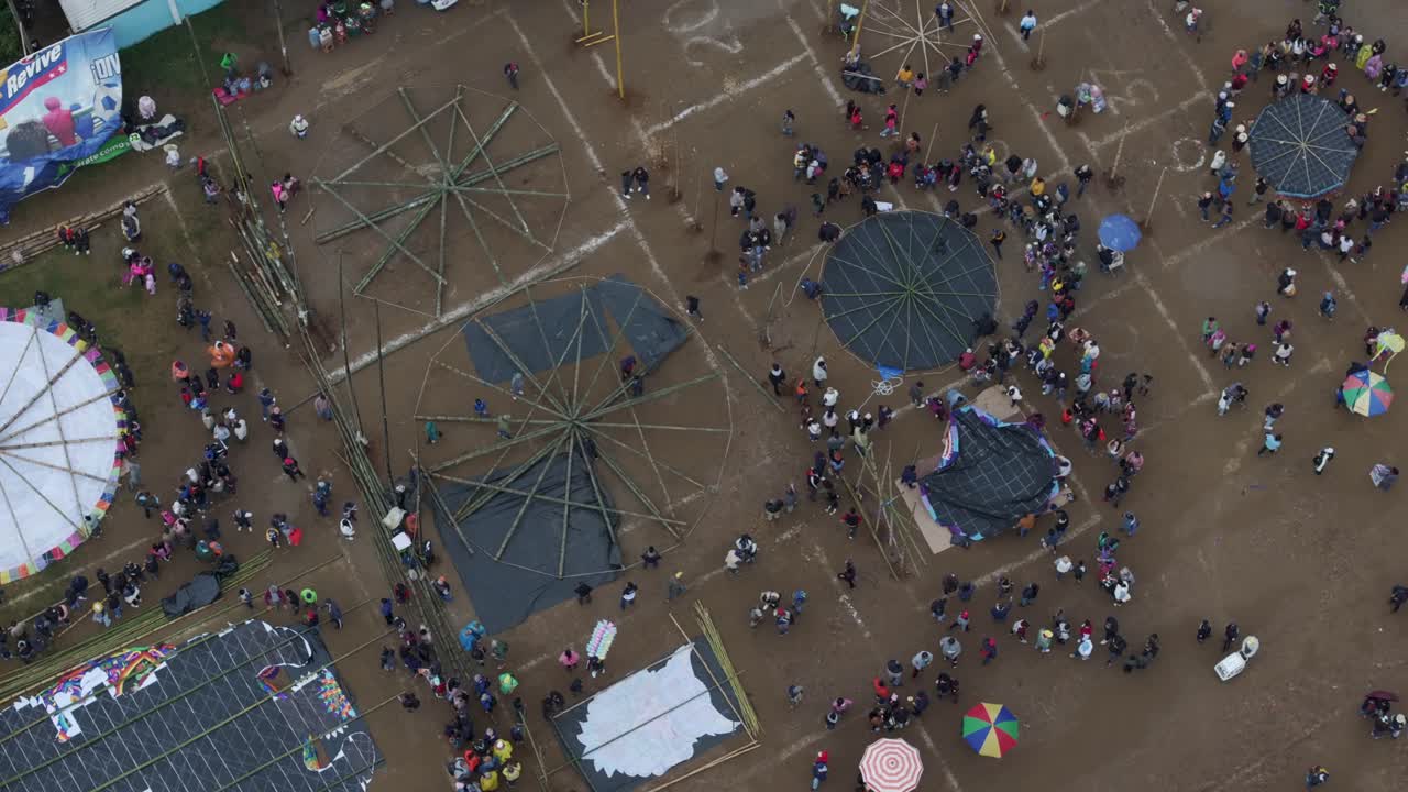 Aerial shot of people prepare kites at all Saint's Day In Sumpango, drone