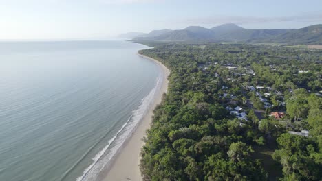 coastal town surrounded with tropical forest at four mile beach, port douglas, queensland, australia