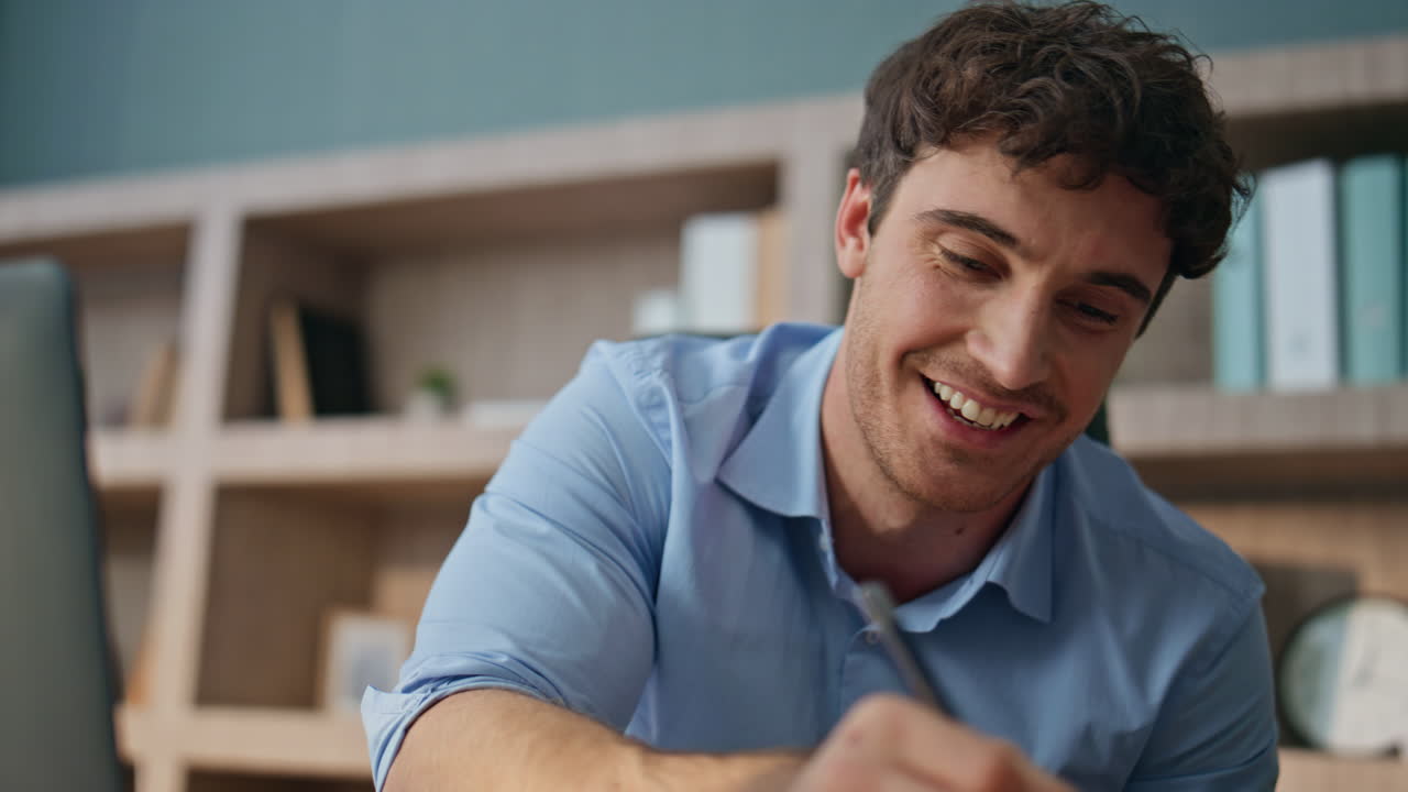 Closeup hands making notes in office. Sales professional talking video meeting