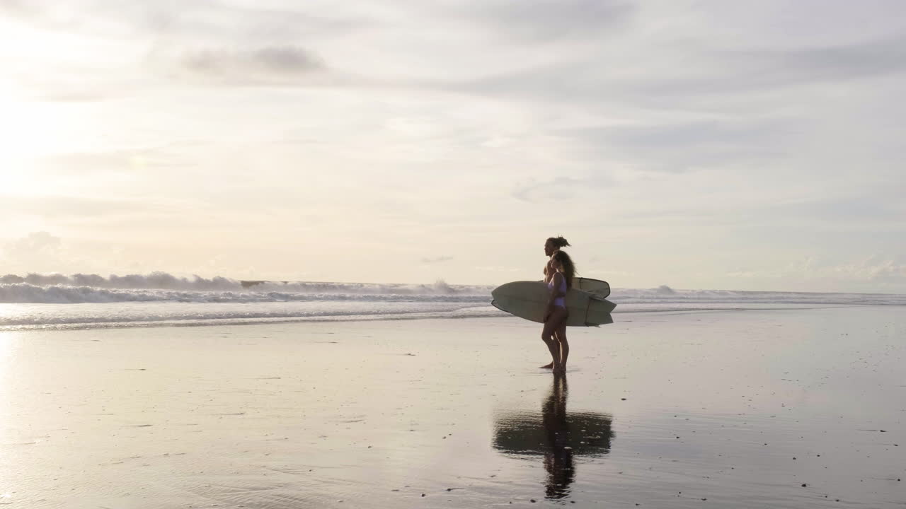 Young couple with surfboards