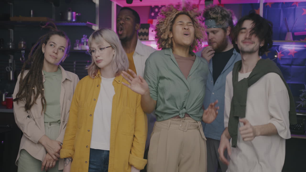 Group of friends partying in a kitchen