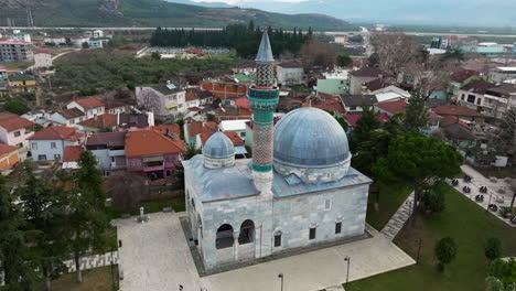 famous green mosque in the historical town of iznik in bursa, turkey - aerial drone shot