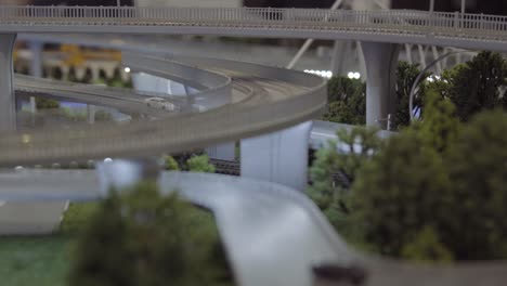 detailed model railway with train and cityscape